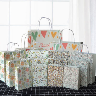 Os sacos de papel reciclados de carregamento fortes com aniversário Kraft dos punhos removem sacos
