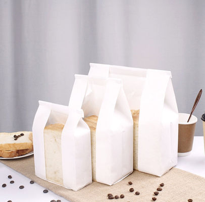 Sacos de papel deslocados do pão de PrintingWhite com os sacos de empacotamento da padaria do GV da janela